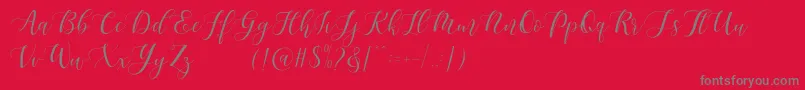 Maheisa Script Free Font – Gray Fonts on Red Background