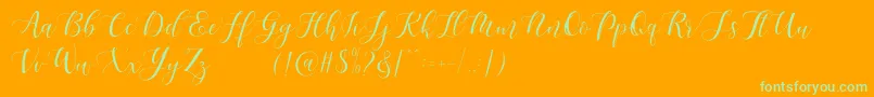 Maheisa Script Free Font – Green Fonts on Orange Background