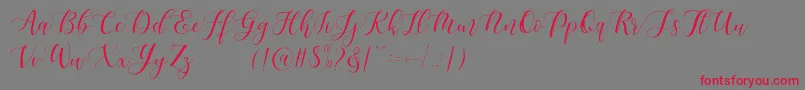 Maheisa Script Free-Schriftart – Rote Schriften auf grauem Hintergrund