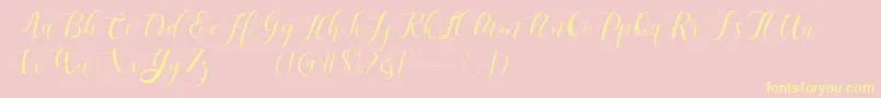 Fonte Maheisa Script Free – fontes amarelas em um fundo rosa