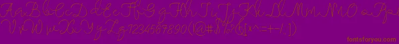 maheishia-Schriftart – Braune Schriften auf violettem Hintergrund