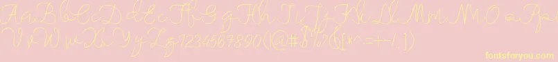 maheishia-Schriftart – Gelbe Schriften auf rosa Hintergrund