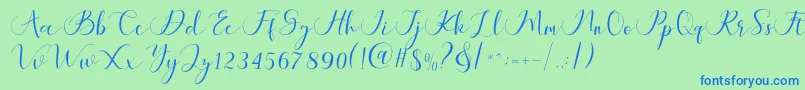 Maheria Script-Schriftart – Blaue Schriften auf grünem Hintergrund