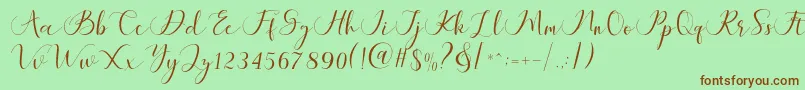 Fonte Maheria Script – fontes marrons em um fundo verde