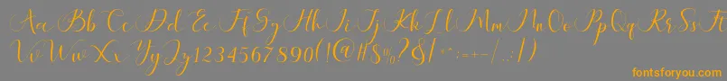 Шрифт Maheria Script – оранжевые шрифты на сером фоне