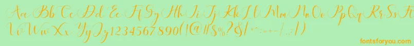 Maheria Script-Schriftart – Orangefarbene Schriften auf grünem Hintergrund