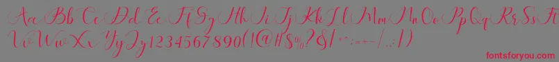 Maheria Script Font – Red Fonts on Gray Background