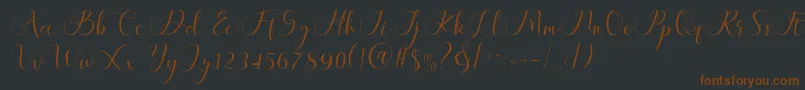 Шрифт Maheria Script – коричневые шрифты на чёрном фоне