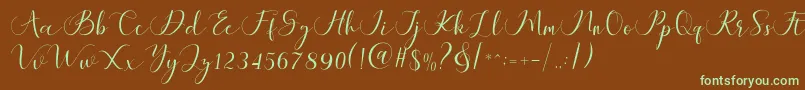 フォントMaheria Script – 緑色の文字が茶色の背景にあります。