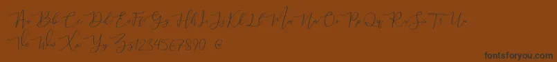 mahligai Demo Font – Black Fonts on Brown Background