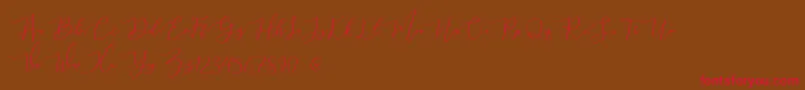 mahligai Demo-Schriftart – Rote Schriften auf braunem Hintergrund