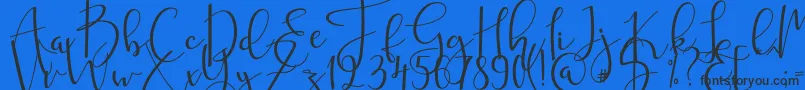 mahligai Font – Black Fonts on Blue Background