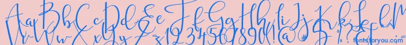 mahligai Font – Blue Fonts on Pink Background