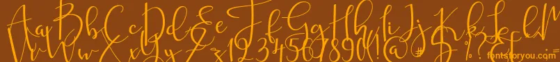 mahligai Font – Orange Fonts on Brown Background