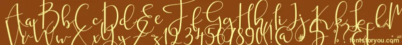 mahligai Font – Yellow Fonts on Brown Background