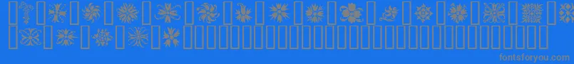 Ornamenter2-Schriftart – Graue Schriften auf blauem Hintergrund