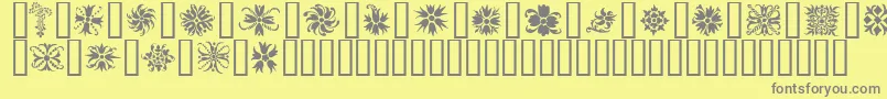 フォントOrnamenter2 – 黄色の背景に灰色の文字