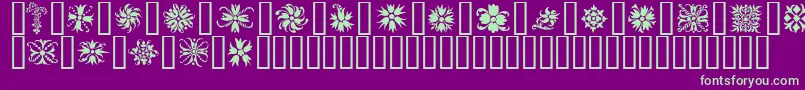 Ornamenter2-fontti – vihreät fontit violetilla taustalla