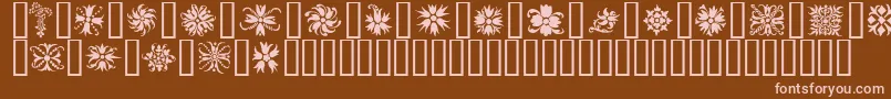 Ornamenter2-Schriftart – Rosa Schriften auf braunem Hintergrund