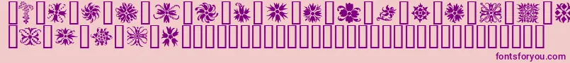 Ornamenter2-fontti – violetit fontit vaaleanpunaisella taustalla