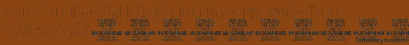 Шрифт MainlandThin PERSONAL – чёрные шрифты на коричневом фоне