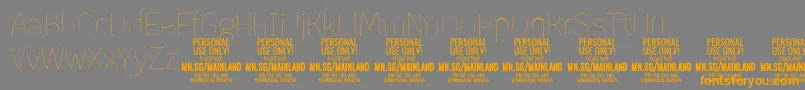 MainlandThin PERSONAL Font – Orange Fonts on Gray Background