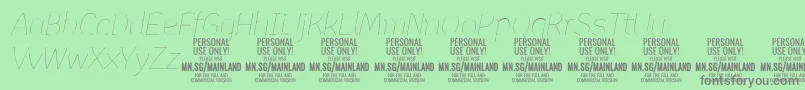 フォントMainlandThinItalic PERSONAL – 緑の背景に灰色の文字