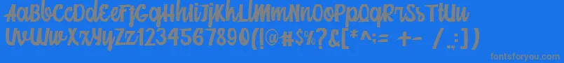 Fonte Mainstream Script – fontes cinzas em um fundo azul