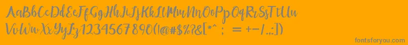 maisha script Demo-Schriftart – Graue Schriften auf orangefarbenem Hintergrund