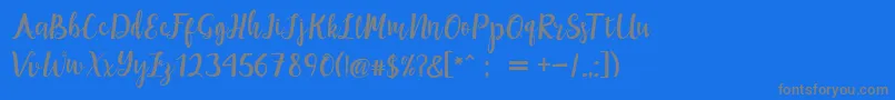 maisha script Demo Font – Gray Fonts on Blue Background