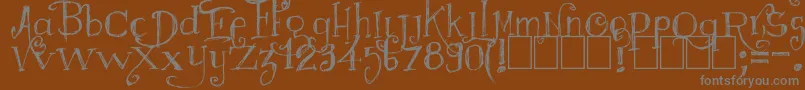 Majestrick Font – Gray Fonts on Brown Background