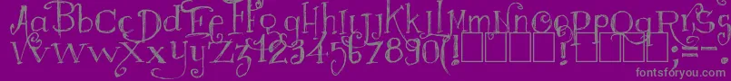 Majestrick-fontti – harmaat kirjasimet violetilla taustalla