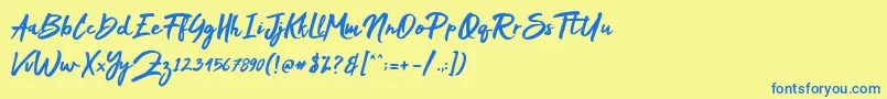 フォントMak Dah – 青い文字が黄色の背景にあります。