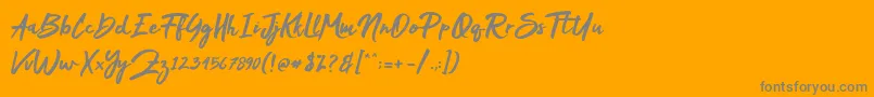 Mak Dah-Schriftart – Graue Schriften auf orangefarbenem Hintergrund