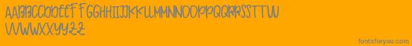 Makaw Free-Schriftart – Graue Schriften auf orangefarbenem Hintergrund