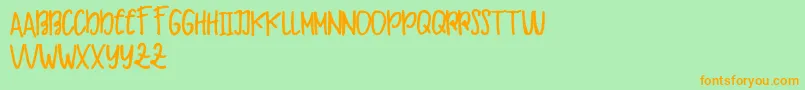 Makaw Free Font – Orange Fonts on Green Background