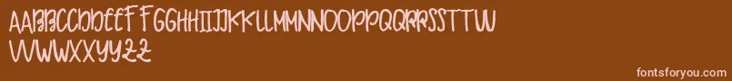 Makaw Free Font – Pink Fonts on Brown Background