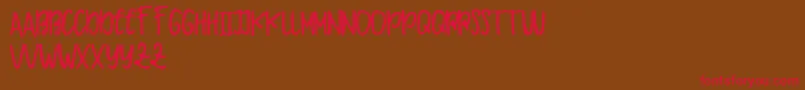 Makaw Free Font – Red Fonts on Brown Background