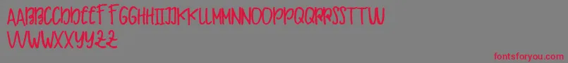 Makaw Free-Schriftart – Rote Schriften auf grauem Hintergrund
