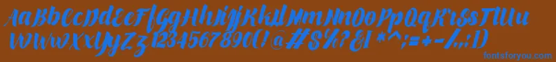 makinglovem Font – Blue Fonts on Brown Background
