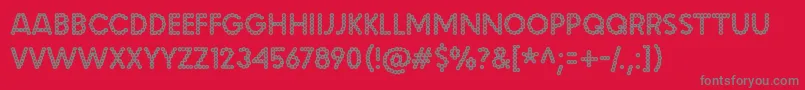 malache crunch-Schriftart – Graue Schriften auf rotem Hintergrund