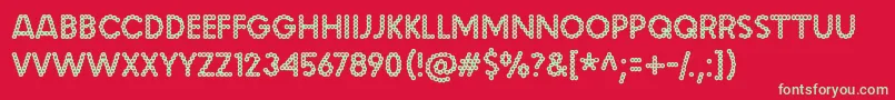 malache crunch-Schriftart – Grüne Schriften auf rotem Hintergrund