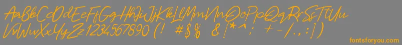フォントMalaya – オレンジの文字は灰色の背景にあります。