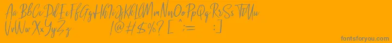 Malenna DEMO-Schriftart – Graue Schriften auf orangefarbenem Hintergrund