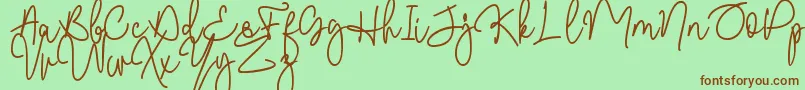 Czcionka Malibbie DAFONT – brązowe czcionki na zielonym tle