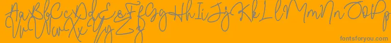 Malibbie DAFONT-Schriftart – Graue Schriften auf orangefarbenem Hintergrund