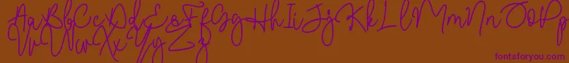 Malibbie DAFONT-Schriftart – Violette Schriften auf braunem Hintergrund