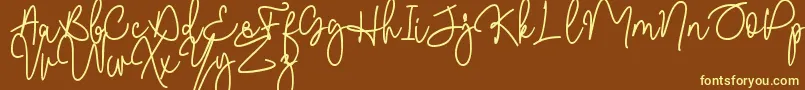 Шрифт Malibbie DAFONT – жёлтые шрифты на коричневом фоне