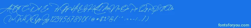フォントManchester Signature – 青い背景に緑のフォント