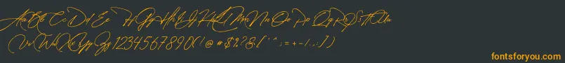フォントManchester Signature – 黒い背景にオレンジの文字